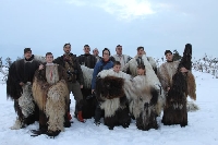 Кукери от Разлог с фотосесия в снега за списание  Нешънъл Джиографик”