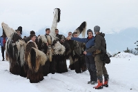 Кукери от Разлог с фотосесия в снега за списание  Нешънъл Джиографик”